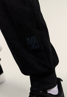 Washed joggers with 50 Years of Movement patch - Black